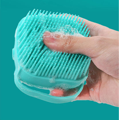 Massage brush with soap container