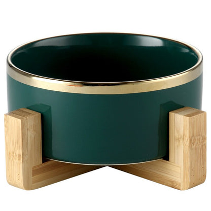 Elegant ceramic food bowl with gold rim and stable wooden base